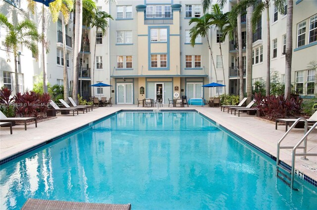 view of swimming pool with a patio