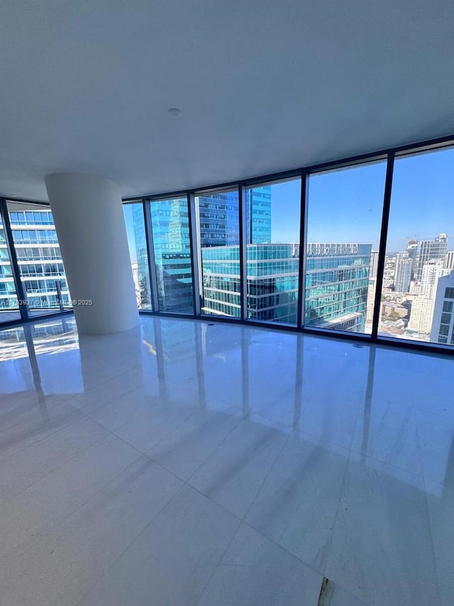 empty room featuring floor to ceiling windows