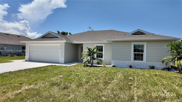 ranch-style home with a garage and a front lawn