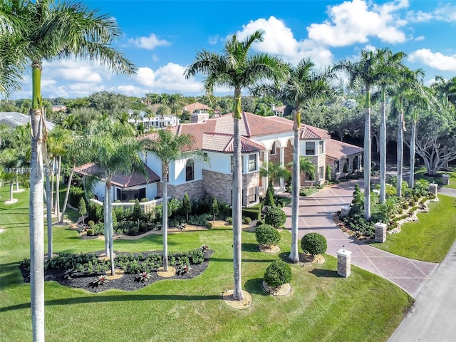 view of home's community with a yard