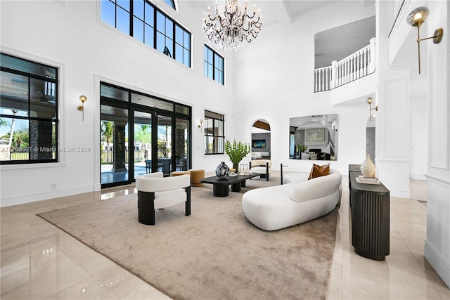 living room with french doors and a high ceiling