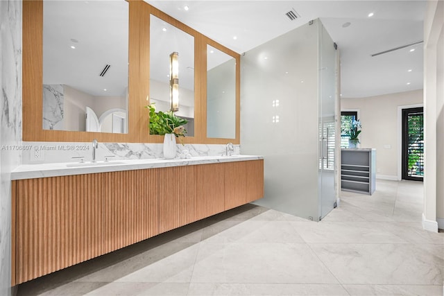 bathroom featuring vanity and tasteful backsplash