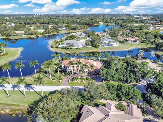 birds eye view of property with a water view