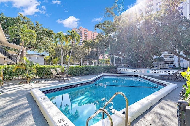 view of swimming pool featuring a patio area