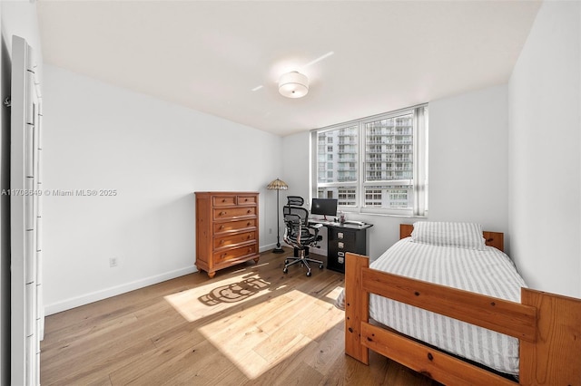 bedroom with light hardwood / wood-style floors