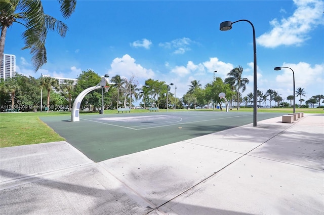 view of basketball court featuring a yard