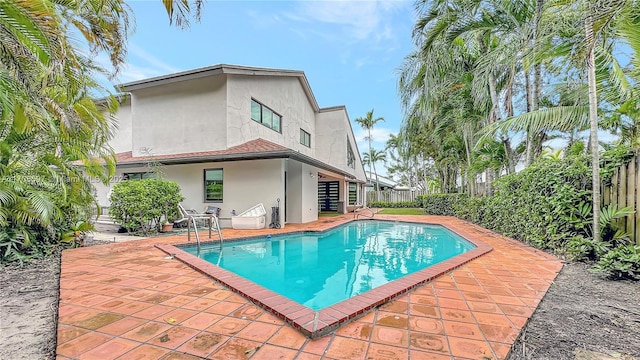 view of swimming pool featuring a patio area