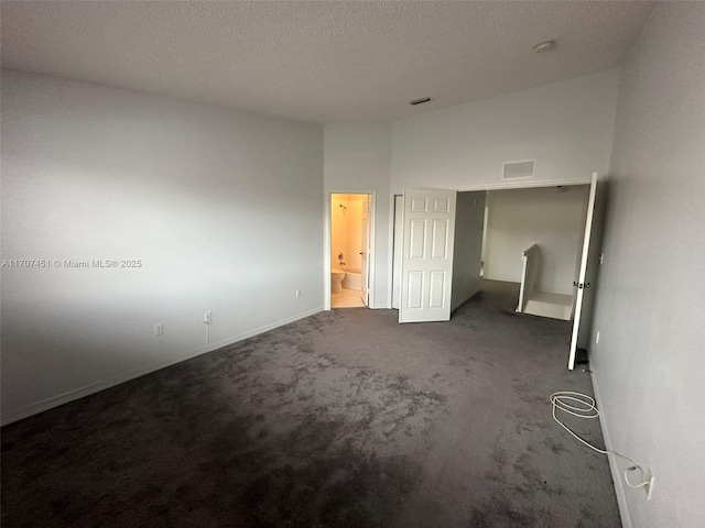 2306 SE 23rd Ter Unit 2306, Homestead, FL 33035 - unfurnished bedroom with carpet flooring and a textured ceiling