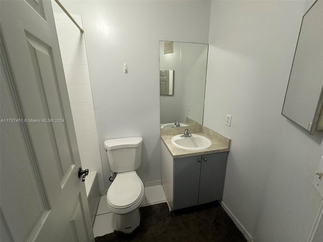 bathroom with tile patterned floors, vanity, and toilet