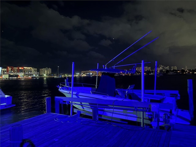 exterior space featuring a dock and a water view