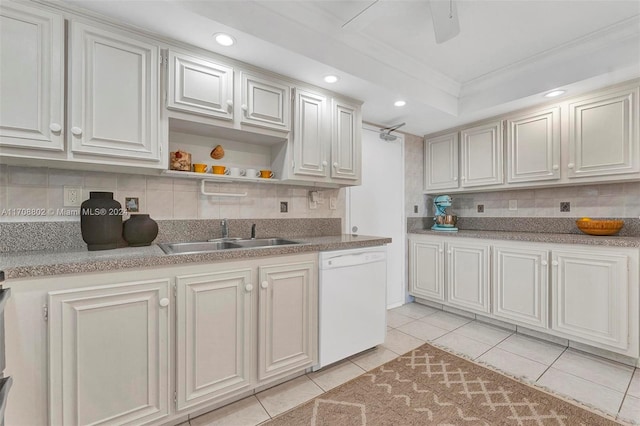 kitchen featuring decorative backsplash, dishwasher, light tile patterned floors, and sink