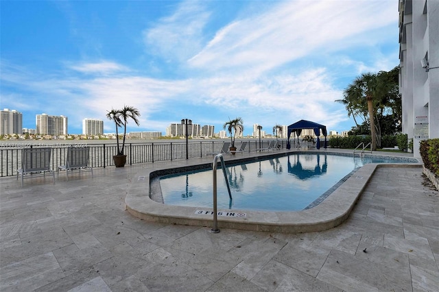 view of swimming pool with a gazebo and a patio