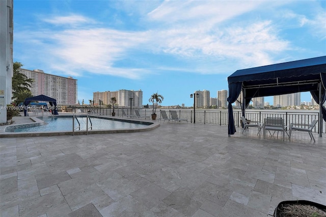 view of pool with a gazebo and a patio