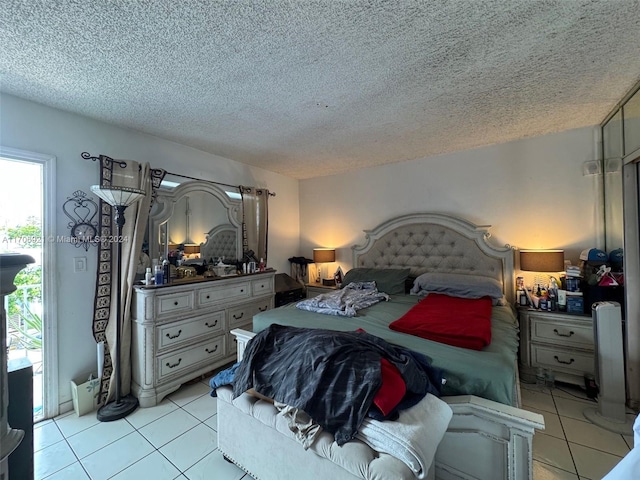 tiled bedroom featuring a textured ceiling