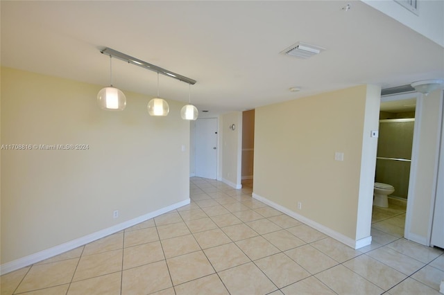 unfurnished room with light tile patterned floors