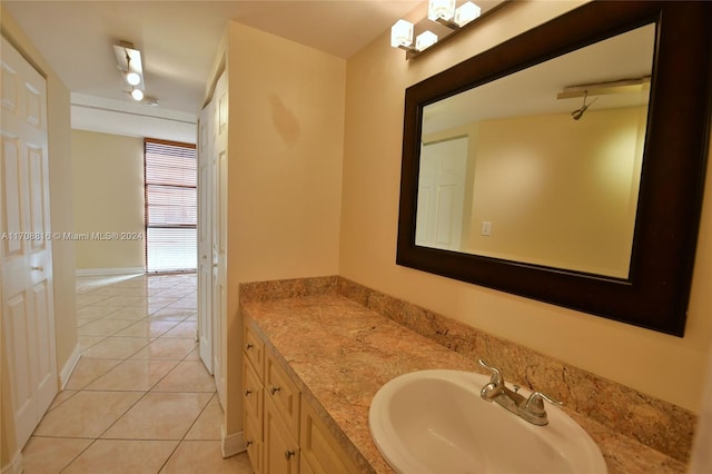 bathroom with tile patterned floors and vanity