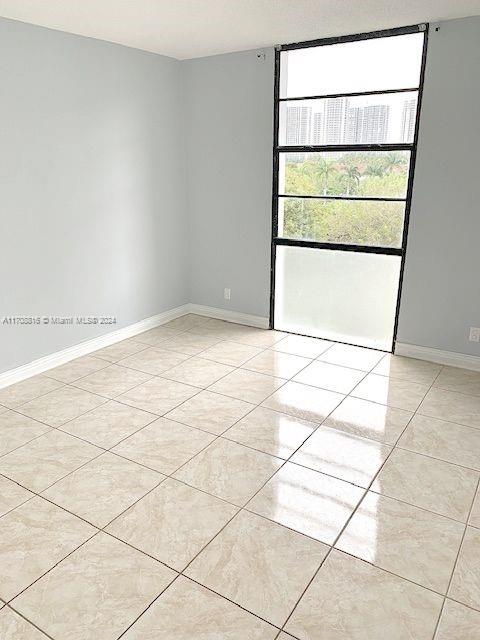 view of tiled spare room