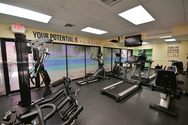 gym featuring a drop ceiling