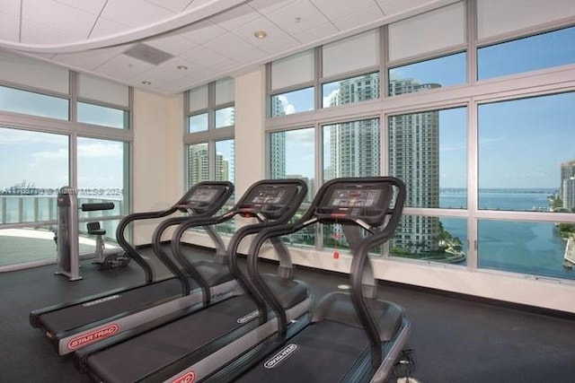 gym featuring a drop ceiling