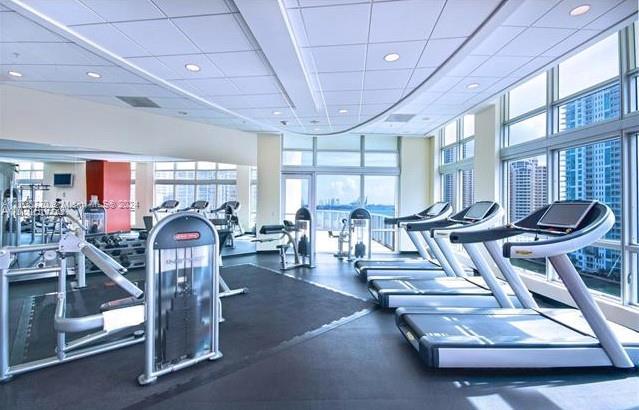 workout area featuring a paneled ceiling