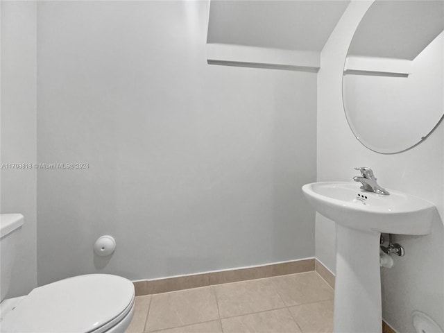 bathroom featuring tile patterned flooring and toilet