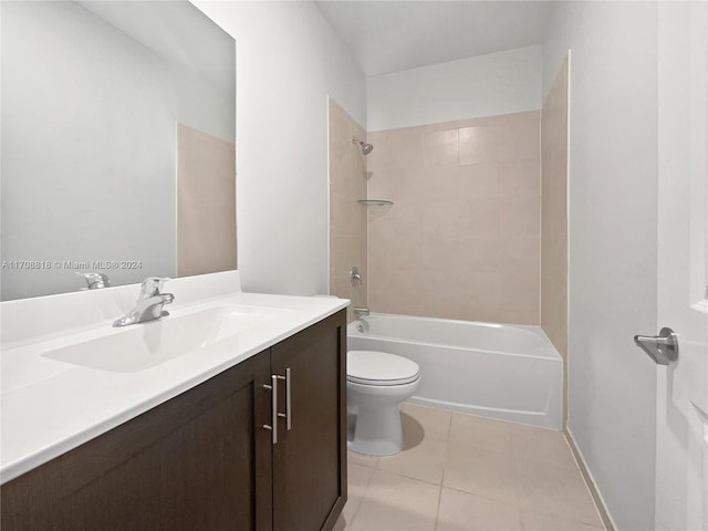 full bathroom with tile patterned flooring, vanity, toilet, and tiled shower / bath