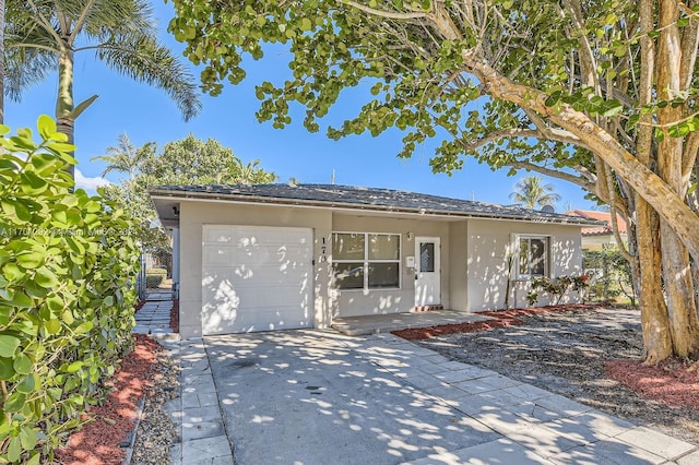 ranch-style house featuring a garage