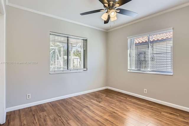 spare room with hardwood / wood-style floors, ceiling fan, and ornamental molding