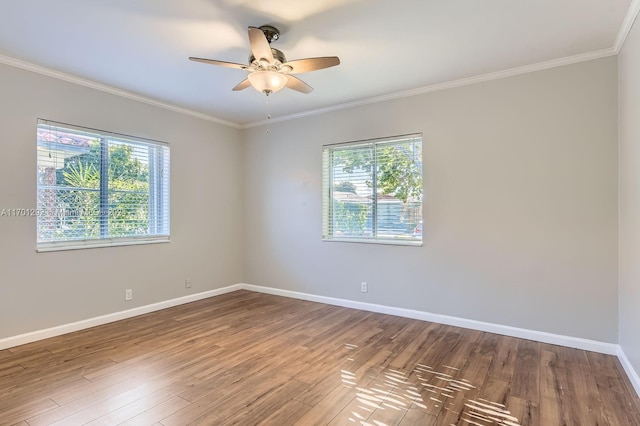 spare room featuring crown molding, ceiling fan, and wood-type flooring