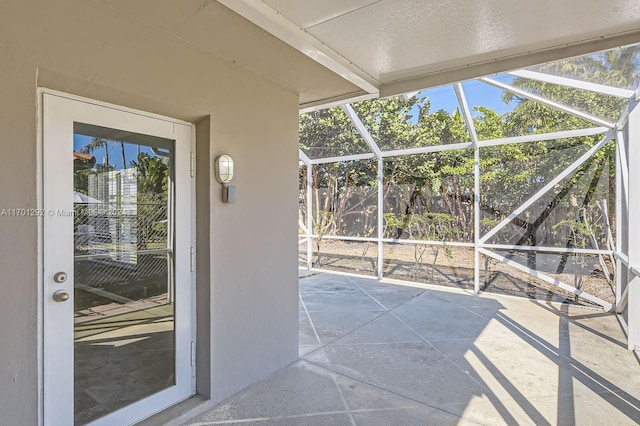 unfurnished sunroom with a wealth of natural light