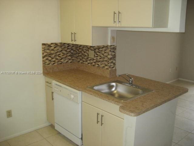 10776 N Kendall Dr Unit F-16, Miami, FL 33176 - kitchen featuring dishwasher, light tile patterned flooring, tasteful backsplash, light countertops, and a peninsula