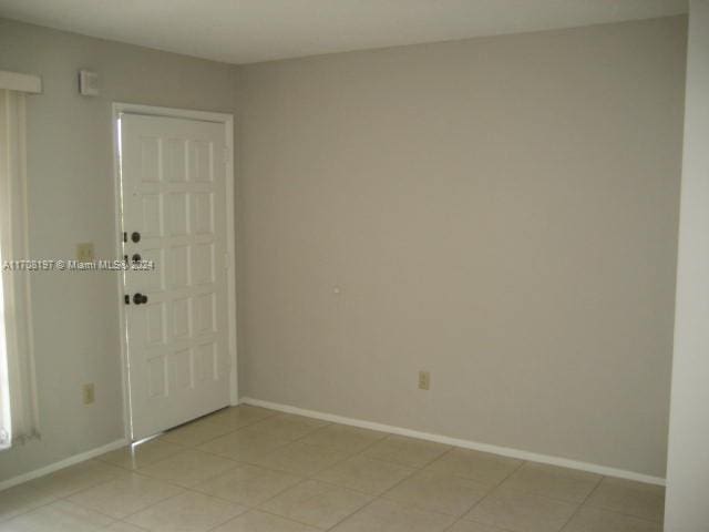 view of tiled spare room