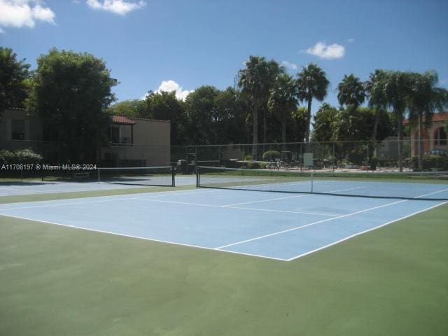 view of sport court with basketball hoop