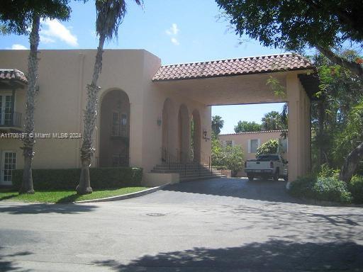10776 N Kendall Dr Unit F-16, Miami, FL 33176 - view of front of house featuring stucco siding, a tile roof, and driveway