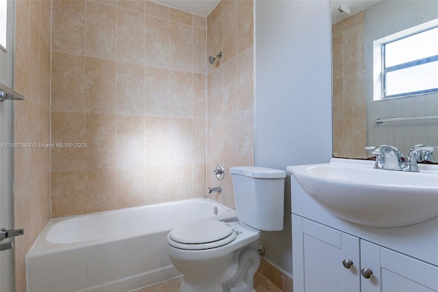 full bathroom featuring toilet, vanity, and tiled shower / bath