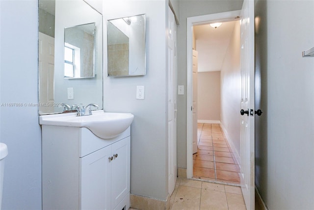 bathroom featuring tile patterned flooring and vanity