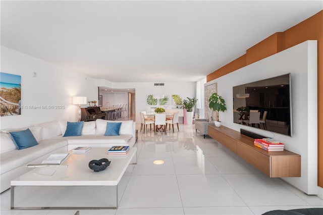 living room with visible vents and light tile patterned floors