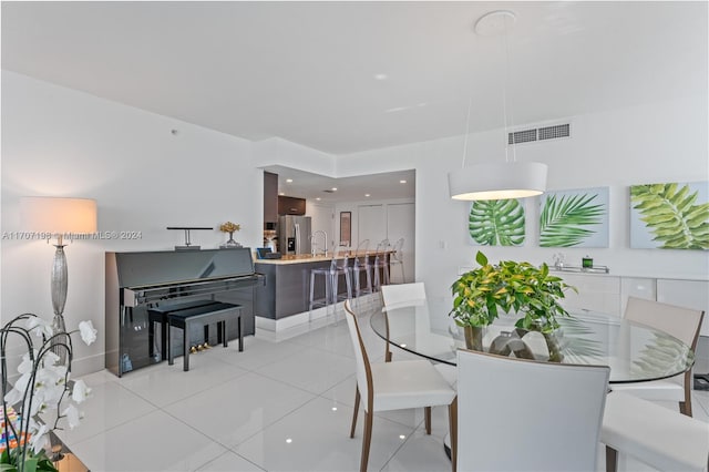 tiled dining area with sink