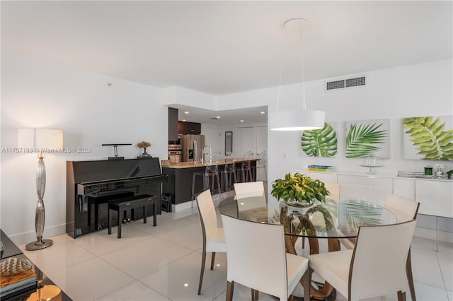 dining room with visible vents and light tile patterned floors