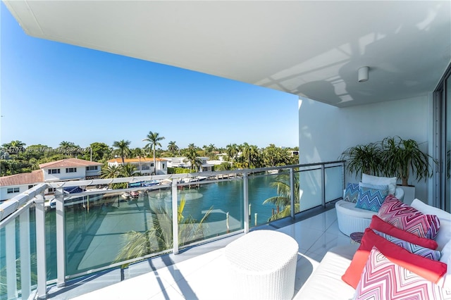 balcony featuring a water view