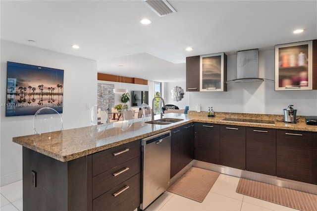 kitchen featuring stainless steel dishwasher, a sink, a peninsula, black electric stovetop, and wall chimney exhaust hood
