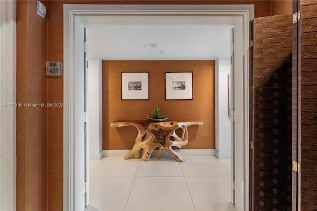 hall with tile patterned flooring