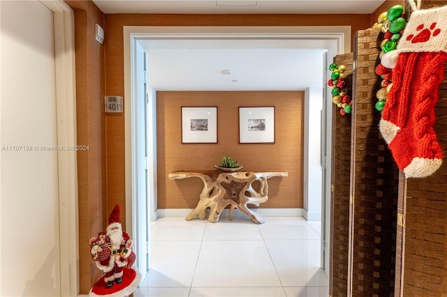 corridor featuring light tile patterned flooring