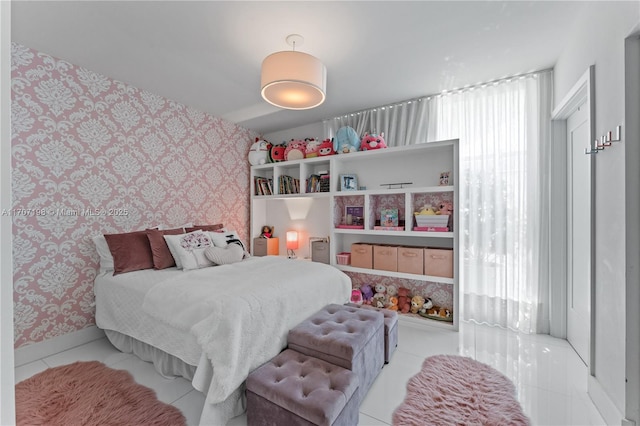 tiled bedroom with baseboards and wallpapered walls