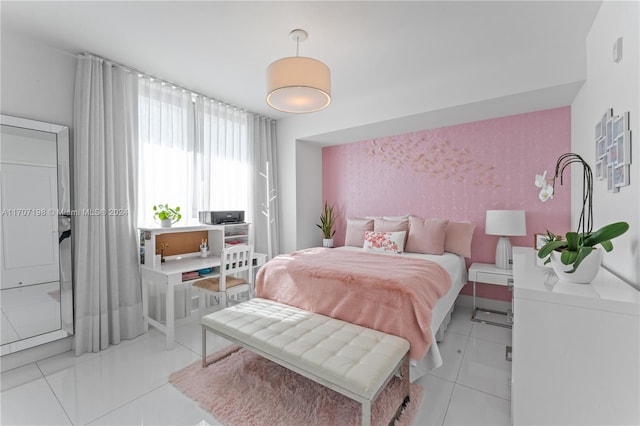 bedroom featuring light tile patterned flooring