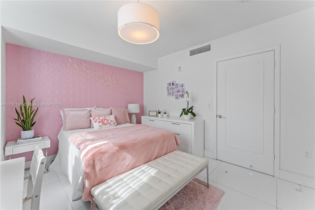 bedroom featuring visible vents and light tile patterned floors