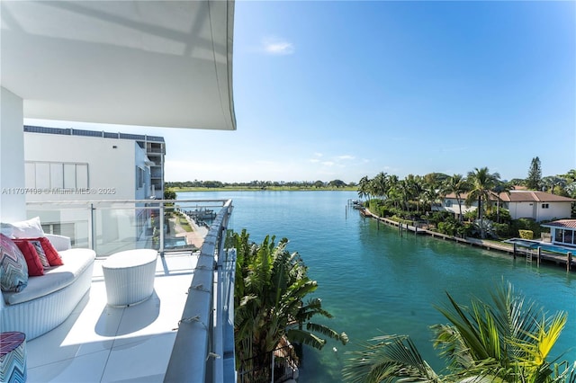 balcony featuring a water view