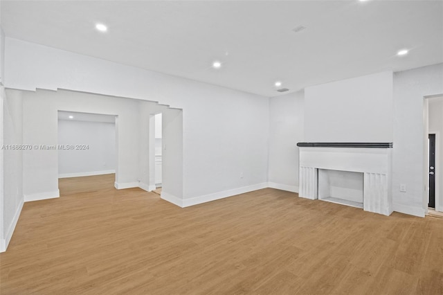 unfurnished living room featuring light hardwood / wood-style floors