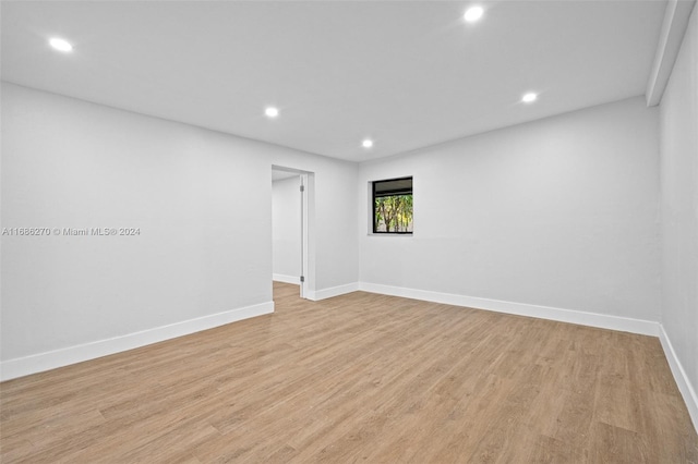 spare room with light wood-type flooring