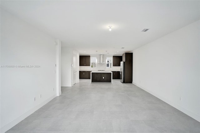 unfurnished living room featuring light tile patterned flooring